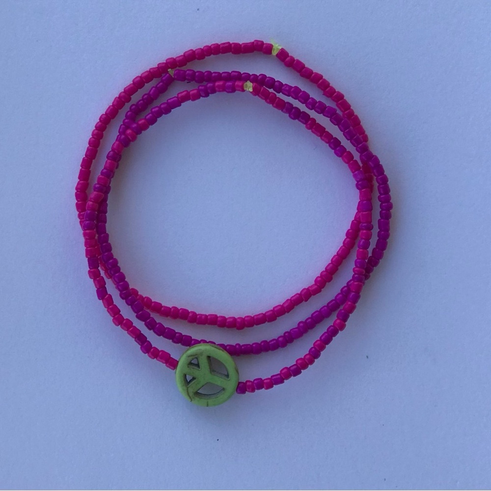 Vibrant Pink Beaded Bracelet with Green Charm